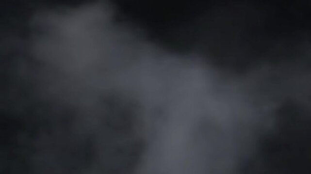 close up of white smoke on black background	
