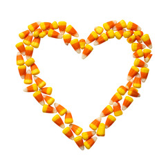 Candy corn arranged in a heart shape against a for halloween love on transparent background