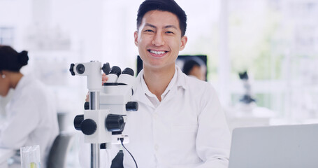 Science, lab and portrait of man with microscope for study, medical research and vaccine development. Happy, pharmaceutical job and scientist with equipment for medicine, experiment and breakthrough