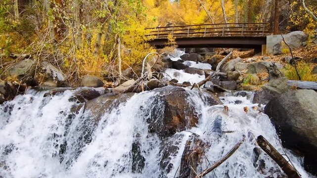 autumn waterfall over bridge in the inyo national forest