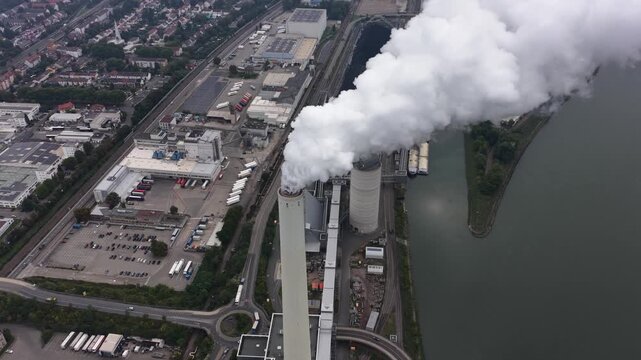 Power plant in Mannheim Germany. Smoking chimney, industrial facility. Aerial views.