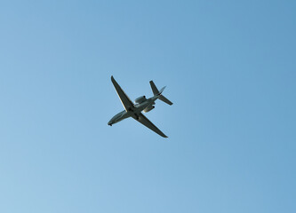 small plane flying low in the sky with space for text