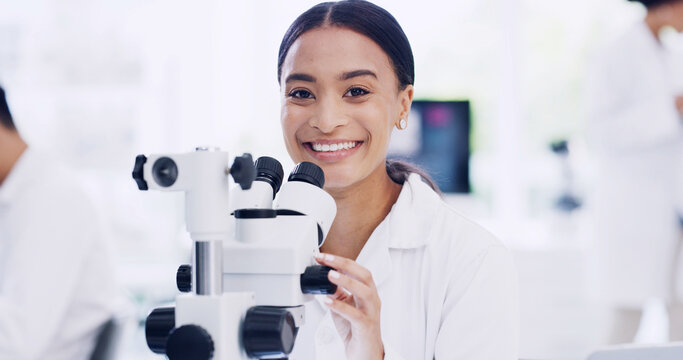 Portrait, scientist and happy woman with microscope, research and medical development. Smile, science and confident person with microbiology equipment, professional and career pride in laboratory