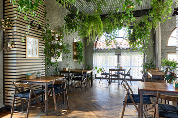 Cozy indoor cafe filled with plants and natural light