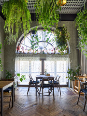 Cozy cafe interior with greenery and natural light for relaxation
