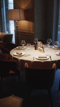 Elegant dining setup in a cozy restaurant at sunset