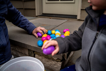 Close Up of Grandma and Grandson Collecting Plastic Easter Eggs