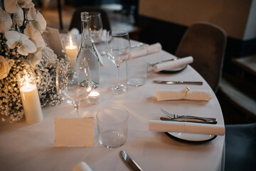 Elegant Table Setting with Candles and Flowers