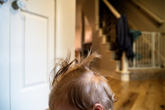 Side View of Messy Toddler Girl Hair in Family Home