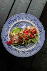 Sandwich with tomato and fish on a blue plate autumn vibe