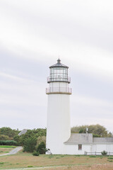 White lighthouse providing guidance on overcast day