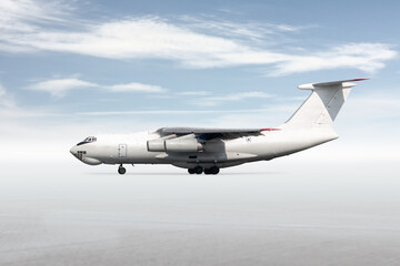 White wide body transport freight airplane isolated on bright background with sky