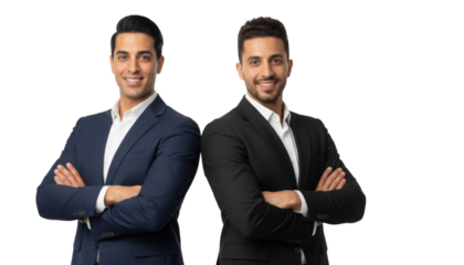 Two confident Middle Eastern businessmen stand back to back smiling, showcasing teamwork and partnership in modern business