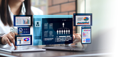 Marketer using digital marketing dashboard with charts, pie graphs, organization chart, and...