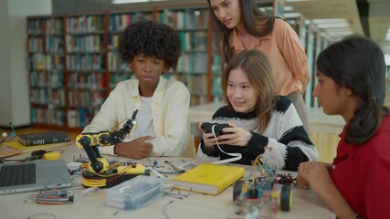 Group of students learning together to build electronic car model construction project. Innovative technology development - Powered by Adobe