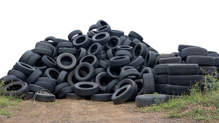 Low angle view of isolated piles of car tires left on the ground ready to be reused at a car repair shop, a common sight in rural Thailand.