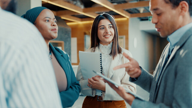 Business people, meeting or discussion with tablet for project planning, proposal or idea in office. Group, employees or conversation with technology for team strategy, agenda or tasks in workplace - Powered by Adobe