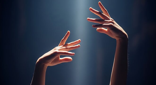 Expressive hands reaching up in dramatic light, conveying hope, aspiration, and connection, perfect for wellness, artistry, or spiritual concepts