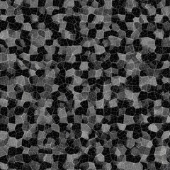 Abstract grayscale pattern of irregular, mosaic-like shapes on a dark background