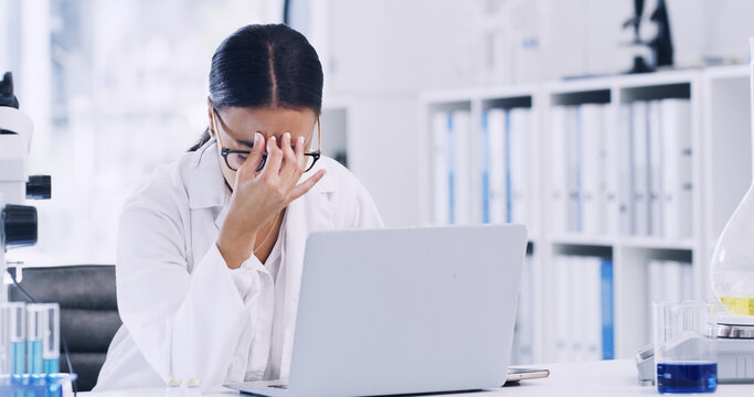 Woman, scientist or laptop with stress in laboratory for forensic research, fail or mistake. Female person, healthcare worker or science with headache on computer for pressure or medical deadline