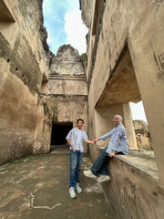 Couple savors their time at Taman Sari Water Castle, appreciating its rich history and beauty