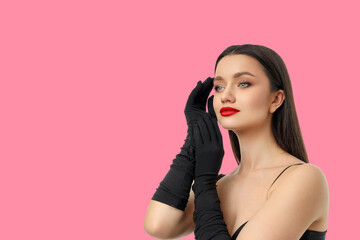 Elegantly posed woman with long dark hair and red lips