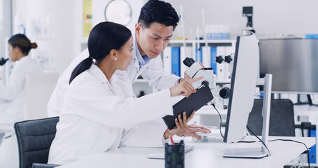 Computer, scientist and discussion with tablet in lab, research biotech innovation or medical development. Healthcare advancement, trial results and people check pharma test, tech and medicine report