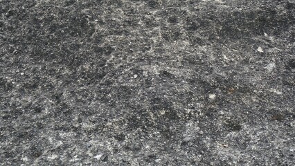 Textured gray cement wall. Cement wall background, rough, wavy surface, stone wall, vintage exterior pattern.