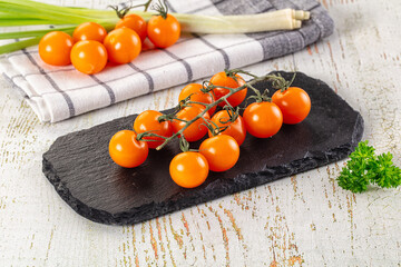 Ripe juicy yellow cherry tomatoes