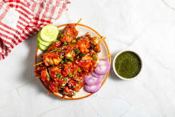 Paneer satay is a grilled Indian appetizer made with marinated paneer cubes, skewered, and served with spicy peanut or yogurt dip.
