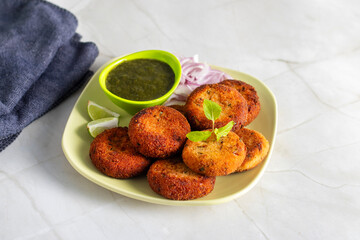 "Dahi ke kebab", a creamy, spiced yogurt patties mixed with herbs and breadcrumbs, shallow-fried to golden perfection, soft inside, crisp outside.
