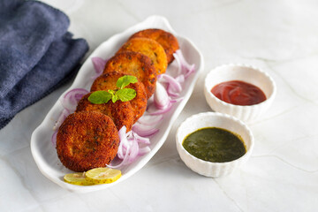 "Dahi ke kebab", a creamy, spiced yogurt patties mixed with herbs and breadcrumbs, shallow-fried to golden perfection, soft inside, crisp outside.
