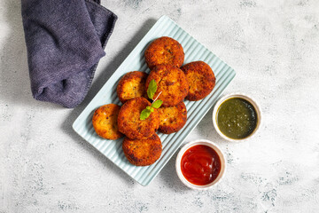 "Dahi ke kebab", a creamy, spiced yogurt patties mixed with herbs and breadcrumbs, shallow-fried to golden perfection, soft inside, crisp outside.
