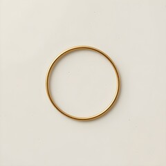 Elegant gold bangle bracelet on a light background for jewelry design or fashion advertising