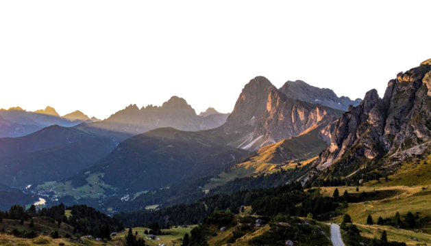 Mountainous landscape at sunset featuring layered hills