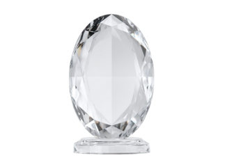 Sparkling, faceted, clear, egg-shaped sculpture on a rectangular base, isolated on black