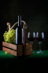 Still life with grapes and wine in glasses