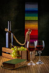 Still life with grapes and wine in glasses