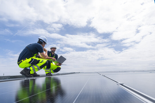 Professional Engineer Team Service Solar Panel. Worker Maintenance Cleaning Replacing Solar Panel.