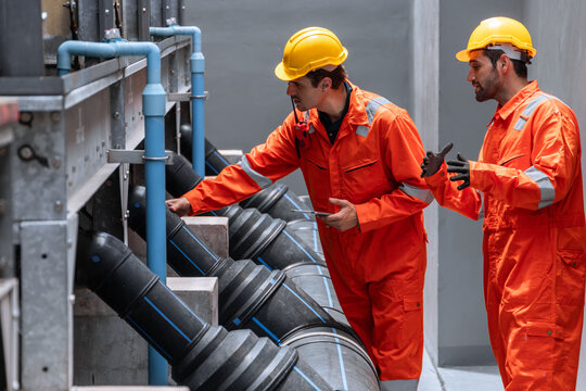 Professional plumbing pipe, Water cooling system engineer man working check large water pipeline.