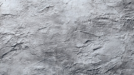 Obraz premium Textured gray stone, showcasing the natural patterns and rough surface of the material. The stone's surface reveals intricate details