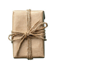 Obraz premium Wrapped gift box in brown paper tied with twine, isolated on black background