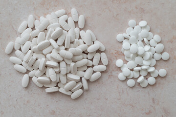 Assorted pills arranged by type, ideal for pharmaceutical research visuals, educational materials, or medical presentations.