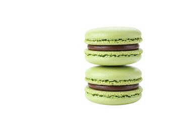 Isolated macaron tower stack, light green pastry filled with chocolate, sweet dessert