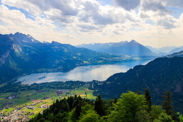 Obraz premium Breathtaking aerial view of Lake Thun and Swiss Alps from Harder Kulm viewpoint, Switzerland