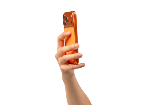 Rear view of a hand holding a new cosmic orange smartphone isolated on transparent PNG.