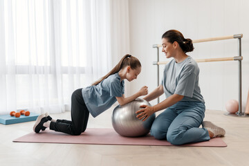 girl doing exercises under doctor's supervision