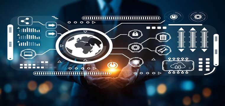 Businessman holding digital world globe with technology icons and data streams in urban night setting, illustrating global connectivity and innovation themes