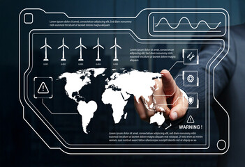 Businessman interacts with digital interface showing renewable energy options, wind turbines, world map, and various data analytics for sustainable development
