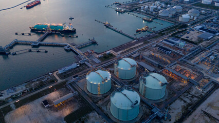 LNG (Liquified Natural Gas) tanker anchored in Gas terminal gas tanks for storage. Oil Crude Gas Tanker Ship. LPG at Tanker Bay Petroleum Chemical or Methane freighter export import transportation